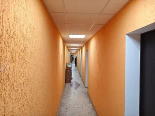 Земельный участок площадью 701 кв. м, кадастровый номер 51:20:0003184:348 (категория земель: земли населенных пунктов, вид разрешенного использования: автостоянки для временного и постоянного хранения индивидуальных легковых автомобилей открытого типа наземные охраняемые и неохраняемые гостевые…