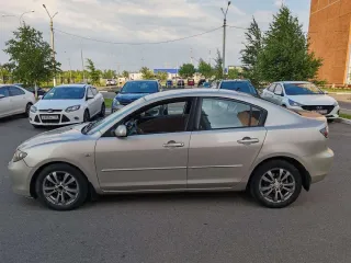 Mazda 3, 2006 МАЗДА 3, 2006 г.в., VIN: JMZBK12Z571549254 Легковой автомобиль МАЗДА 3, 2006 г.в., VIN: JMZBK12Z571549254, кузов № JMZBK12Z571549254, цвет СЕРО-ЗОЛОТИСТЫЙ, мощность (кВт/л.с.): 77.0/104.72 (царапина с левой стороны (передняя и задняя дверь), потёртости на заднем бампере справа, помят…
