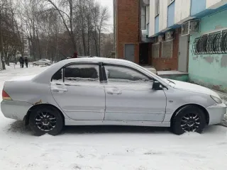 Mitsubishi Lancer 2004 года, 98 л.с., пробег 250000 км, АКПП. Транспортное средство Mitsubishi Lancer 1.6, 2004 года выпуска, регистрационный номер М110НТ21, VIN JMBSRCS3A5U006276.