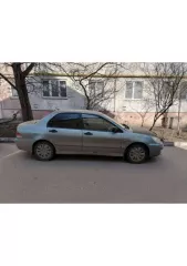 Легковой автомобиль марки Mitsubishi, модель Lancer 1.3, год выпуска 2006. Кузов JMBSNCS1A7U001426, VIN JMBSNCS1A7U001426. Задний бампер имеет трещину у багажника, катафотик на заднем разбит. Передние фары помутнели. Арки и пороги имеют цветение. Притертость переднего бампера. Требуется замена…