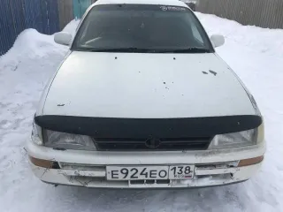 Toyota Corolla, 1992 года, 105 лс, 354746 км, АКПП, Автомобиль Тойота Королла 1992 г.в.; г/н: Е924ЕО138; цвет: Белый; Номер кузова (прицепа): AE1000008789; № двигателя: G782004. Двигатель дымит, требуется замена поршневой. Опорный правый подшипник под замену, задние тормозные колодки изношены.