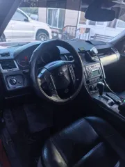 Land Rover Range Rover Sport 2006, 390 лс, 295083 км, полный привод, АКПП, легковой автомобиль, марка: Land Rover, модель: Range Rover Sport, год изготовления: 2006, цвет: темно-красный, VIN: SALLSAA346A941137, страна: Англия.