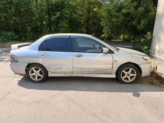 Мицубиси Lancer 1.6, VIN JMBSNCS3A5U005993, 2004 г., госномер М656ХУ 35, серебристый, на ходу