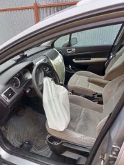 Peugeot 307 SW 2005 года выпуска, идентификационный номер VIN VF33HNFUE83846936, находится в залоге у ООО МФК "КарМани".