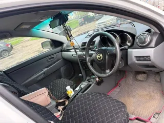 Mazda Axela 2007 года, 114 л.с., пробег 297000 км, АКПП. Автомобиль на ходу. Имеются многочисленные царапины и потертости по кузову, разбита передняя фара. Государственный номер Н911ЕТ125.