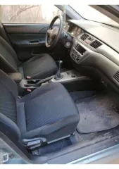 Легковой автомобиль марки Mitsubishi, модель Lancer 1.3, год выпуска 2006. Кузов JMBSNCS1A7U001426, VIN JMBSNCS1A7U001426. Задний бампер имеет трещину у багажника, катафотик на заднем разбит. Передние фары помутнели. Арки и пороги имеют цветение. Притертость переднего бампера. Требуется замена…