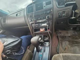 Mitsubishi Canter 1995 года выпуска, госномер К399СО75, номер шасси FE516B-501954. ПТС отсутствует. Кузов имеет следы ржавчины, заднее крыло треснуто. Бампер с левой стороны фонаря поврежден.