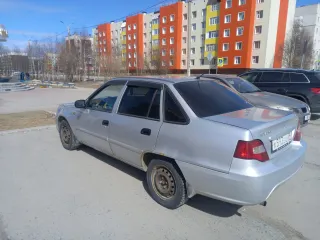 Daewoo Nexia 2009, модель: Нексия, год изготовления: 2009, цвет: перламутрово-серебр