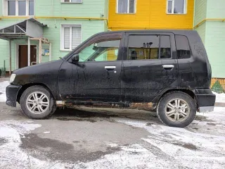 Nissan Cube 2000 года, госномер Н845МУ03, черный цвет. VIN: AZ10039628, двигатель бензиновый 1.3 л (85 л.с.), снаряженная масса 980 кг, полная масса 1200 кг. Производство: Япония.