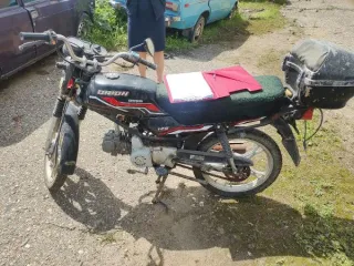 Мопед Orion Gruphon 125 и скутер Honda Dio без государственных регистрационных знаков, ключи и документы отсутствуют, общее техническое состояние ТС - бывшее в эксплуатации, имеющее физический и моральный износ, требующее ремонта; VIN скутера: QM50QW-8497260779, номер двигателя: 97041170.