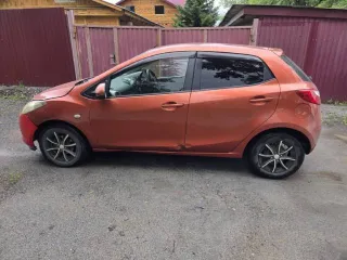 Mazda Demio 2009, 113 лс, АКПП, VIN: DE5FS119964. В залоге у ООО МФК «ПСБ Финанс».