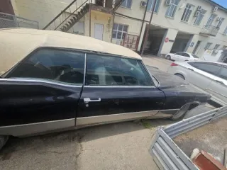 Автомобиль марки Cadillac Coupe Deville, 1970 г.в., VIN FO289501, цвет черный, тип кузова: 2-х дверный седан-coupe. Цена 2 422 330 руб., задаток 363 350 руб., шаг аукциона 24 224 руб. Вид транспорта: легковой.