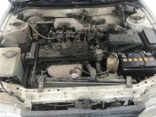 Toyota Corolla, 1992 года, 105 лс, 354746 км, АКПП, Автомобиль Тойота Королла 1992 г.в.; г/н: Е924ЕО138; цвет: Белый; Номер кузова (прицепа): AE1000008789; № двигателя: G782004. Двигатель дымит, требуется замена поршневой. Опорный правый подшипник под замену, задние тормозные колодки изношены.