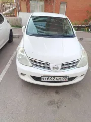 Nissan Tiida (Тиида) 2010 года, 110 лс, 218702 км, АКПП, цвет белый, рабочий объем двигателя 1 498, государственный регистрационный знак Н642НМ 03.