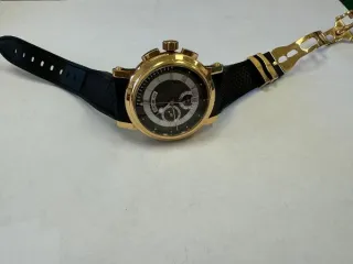 Breguet Marine Chronograph RG ref. 5827BR/Z2/5ZU наручные часы, корпус круглый, из металла золотистого цвета, ремешок из материала черного цвета с замком из металла золотистого цвета. На оборотной стороне штампованная надпись «HORLOGER DE LA», «MARINE», «BREGUET», «468 BP Au750», «REF 5827», б/у…