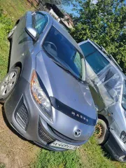 Mazda Axela 2009 года, серийный номер кузова BL5FP-100240, серый цвет. Категория B, двигатель ZY-556747. ПТС 25 УМ 713697.