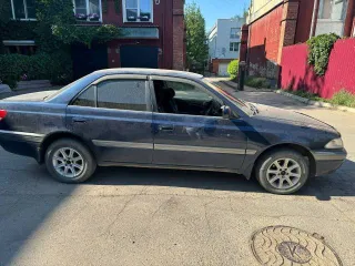 Toyota Carina, 1990 год выпуска, регистрационный знак Р656ЕТ03RUS, VIN не установлен, цвет темно-синий.