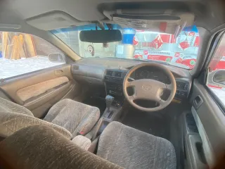 Toyota Corolla, 1997, VIN отсутствует. Характеристика: залог у "Ваш Инвестор". Хрустит наружный шрус с правой стороны. Сайлентблоки и подушки двигателя нужно менять. По корпусу автомобиля множественные следы коррозии и левая сторона в вмятинах.