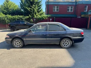 Toyota Carina, 1990 год выпуска, регистрационный знак Р656ЕТ03RUS, VIN не установлен, цвет темно-синий.
