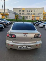 Mazda 3, 2006 МАЗДА 3, 2006 г.в., VIN: JMZBK12Z571549254 Легковой автомобиль МАЗДА 3, 2006 г.в., VIN: JMZBK12Z571549254, кузов № JMZBK12Z571549254, цвет СЕРО-ЗОЛОТИСТЫЙ, мощность (кВт/л.с.): 77.0/104.72 (царапина с левой стороны (передняя и задняя дверь), потёртости на заднем бампере справа, помят…