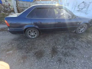 Toyota Sprinter 1998 года, 100 лс, 300000 км, АКПП. VIN отсутствует, кузов № H077749, цвет синий. Коробка затягивает при переключении. По кузову есть недостатки, имеются сколы. В правой стороне спереди не понятные стуки. Возможно наличие иных скрытых недостатков.