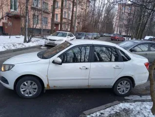 LADA 219010 LADA GRANTA. Год выпуска: 2019. VIN: XTA219010K0591052. Цвет кузова: Белый. Объем двигателя: 1596 см³. Мощность: 64 кВт / 87 л.с. Экологический класс: 5. Тип: Легковой седан. Автомобиль на ходу. Под замену задние тормоза (колодки, барабаны, цилиндры выжимные). Замена задней подвески в…