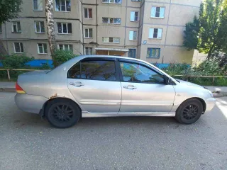 Mitsubishi Lancer 2004 года, 98 л.с., пробег 250000 км, АКПП. Транспортное средство Mitsubishi Lancer 1.6, 2004 года выпуска, регистрационный номер М110НТ21, VIN JMBSRCS3A5U006276.